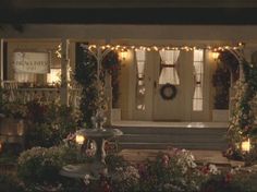 a house decorated with christmas lights and wreaths