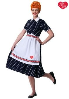 a woman wearing a dress with hearts on it