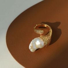 Product information: Process: 18K gold plated Material: Natural freshwater baroque pearls Size: Ring surface height 2cm, ring opening adjustable US (7-8) Pearl Art, Rings Pearl, Woven Ring, Pearl Rings, Open Rings, Irregular Shapes, Fish Tail, Nail Jewelry, Unique Characteristics