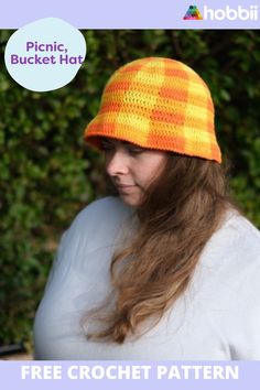 a woman wearing an orange and yellow crochet hat with text overlay that reads, free crochet pattern picnic bucket hat