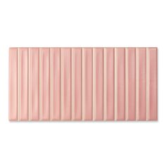 a pink tile wall with vertical stripes on it