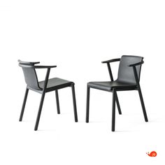 two black chairs sitting next to each other on top of a white surface with the same chair