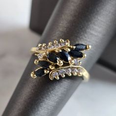 A Womens Vintage Estate 14k Gold Diamond Sapphire Ring. The Ring Weighs 4.6g, And Is A Size Is 7.75. There Are A Total Of 12 Small Diamonds. The Length Of The Ring Is 5/8". Any Questions, Please Don't Hesitate To Ask. Be Sure To Check Out Some Of My Other Great Items Up For Sale. Thank You. Elegant Cluster Sapphire Ring As Gift, Elegant Cluster Sapphire Ring For Gift, Elegant Yellow Gold Cluster Sapphire Ring, Elegant Yellow Gold Sapphire Cluster Ring, Elegant 14k Stamped Marquise Cut Cluster Ring, Elegant Marquise Cut Cluster Ring Stamped 14k, 14k Gold Cluster Sapphire Ring For Formal Events, Formal Cluster Sapphire Ring In 14k Gold, Formal 14k Gold Cluster Sapphire Ring