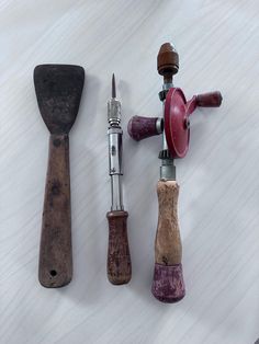 three different types of wood shaving tools on a white surface with one being used as a sharpener