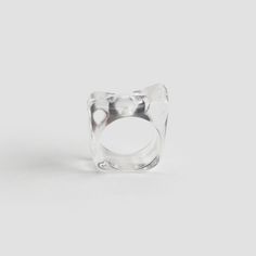 Step up your style game with our Clear Abstract Resin Ring—a modern piece with an effortlessly cool, transparent resin design. This one size ring fits like a size 7 and is as comfortable as it is bold, adding edge to any look. Crafted from high-quality resin, it’s hypoallergenic and tarnish-resistant, ensuring it stays vibrant and true to color even with sensitive skin. If you’re looking for a statement piece that combines quality and unique style, this Clear Resin Ring is your go-to accessory. Transparent Resin, Resin Design, Glamorous Style, Resin Ring, Timeless Accessories, Clear Resin, Steel Jewelry, Stainless Steel Jewelry, Modern Fashion