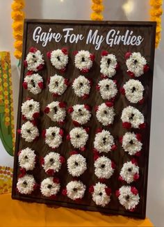 there is a sign that says girve for my girls on it and some flowers in the background