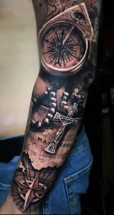 a man's arm with a map and compass on it