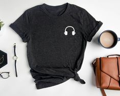 Headphone Shirt, Pocket T-Shirt, Minimal DJ Shirt, Unisex DJ Outfit, Pocket Headphone Tee, Music Lover Shirt, Shirt For DJ, Music Outfit Welcome to my BEB Tee Design store!  In my shop, you will find high quality Bella Canvas and Gildan Soft Style Brand T-Shirts. My shirts are soft and regular relax fit.  Hey! Don't forget to see the drop-down menus for the sizes and colors that you would like to order.  And it is so important to check the size charts in the listings.  These are the information Dj Outfit, Shirt Pocket, Dj Music, Bleach Wash, Music Lover, Pocket Tshirt, Size Charts, Soft Style, Tee Design