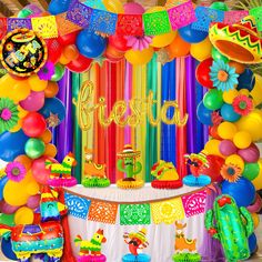 a colorful fiesta themed birthday party with balloons and streamers