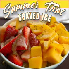 a bowl filled with fruit sitting on top of a table