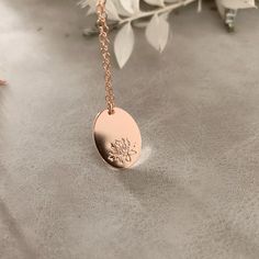 Our oval disc pendant is an elegant alternative to the classic round pendant necklace, personalised with your special birth month flower. Add an initial to personalise it even further. Oval disc measures 18mm x 13mm & fits 1 birth flower and (optional) initial Initial is hand stamped to the bottom right of the pendant in our 1.5mm tiny block font Pendant can only be hand stamped on one side Each Stamp + Shine piece is made from scratch in our little studio in Melbourne, Australia. The process be Round Pendant Necklace, Baby Bracelet, How To Clean Metal, Month Flowers, Disc Pendant, Birth Month Flowers, Oval Pendant, Round Pendant, Birth Flowers