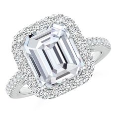 This stunning ring, crafted in 14k white gold, showcases an emerald-cut diamond, prong set within a shimmering halo of diamonds. Accent diamonds cascade down the shank for added brilliance. Classic Halo Engagement Ring, Rings Sapphire, Vintage Engagement Rings Sapphire, Diamond Halo Ring, Platinum Engagement Rings, Halo Diamond Ring, Vintage Engagement, Emerald Cut Diamonds