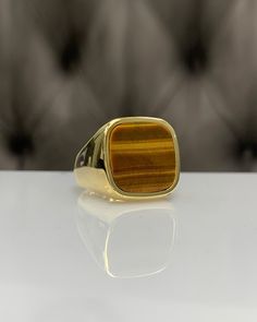 Men Ring with Tiger Eyes Gemstone, Brown Pinky Signet Ring, Square Shape, Stylish Gold / Silver Ring, Handmade Jewelry, Best Gift for Him ◎ Details ◎ ○ Material 14K Solid Gold or 925 Sterling Silver Weight of Ring : approx 18.00 gr Height of Ring : approx 5.30 mm ○ Upgrade to Solid 18K Gold, please click the link below: https://www.etsy.com/listing/962826004 ○ Gemstone Natural Tiger Eyes approx. 15 mm x 15 mm 4.00 ct Made to Order HANDMADE ITEM ○ For Men Collection : https://etsy.me/2PmKJMW All 14k Gold Brown Ring, Brown Gemstone Rings In 14k Gold, Classic Brown Signet Ring For Anniversary, Classic Brown Rings With Polished Finish, Brown Polished Signet Ring For Anniversary, Brown Polished Finish Signet Ring For Anniversary, Classic Brown Signet Ring, 14k Gold Brown Gemstone Jewelry, 14k Gold Jewelry With Brown Gemstones