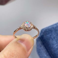 >>>> BASIC OPAL INFORMATION <<<< Round Opal : 5*5mm.Main stone: Natural good fire opal.Side stone: dainty cz diamond (cubic zircon).Material: 925 Sterling Silver +Natural opal stone.Metal color: silver, gold, rose gold. Metal materials: 925 sterling silver, 18K rose gold Plated, 18K rose gold Plated.>>>> SIMPLE DESIGN AND GOOD FIRE <<<>>> CUSTOM METALS <<<< Ring Size: From US #2 to US #15.Supply customized Solid Gold (9K, 14K and Gold Round Cut Opal Ring, Anniversary Opal Birthstone Ring, Opal Jewelry With Round Accent Stones, Opal Cubic Zirconia Ring With Halo Setting For Promise, Cubic Zirconia Opal Ring With Halo Setting For Promise, Round Opal Ring With Cubic Zirconia Accent Stones, Round Opal Jewelry With Halo Detail, Opal Birthstone Ring Round Cut, Pink Opal Round Ring For Anniversary