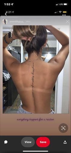 the back of a woman's body with writing on it