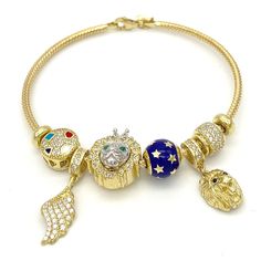 Trendy charm bracelet available in 10k yellow gold. Visit our page to view our full bracelet collection. Metal: 10k Gold Stone: Cubic Zirconia Type: Bracelet Diameter: 2.25" x 2" Width: 2.5mm Clasp: Lobster We guarantee all materials are 100% genuine as stated above. Gold Charm Bracelet With Cubic Zirconia, Gold Cubic Zirconia Bracelet With Charms, Gold Cubic Zirconia Charms Bracelets, Lion Angel, Real Gold Bracelet, West Indian Bangles, Memorial Pendant, Picture Pendant, Gold Bracelets