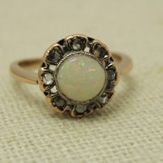 Victorian Opal Mine  Cut Diamond Ring 14k Rose Gold Size 6 14k Rose Gold Size 6 can be sized at a low cost  The Ring is 11.09mm across by 5.3mmin Height  Diamond 0.20ct total and Opal 0.62.ct It Comes with a new ring box item # 5869 14k Rose Gold Round Diamond Ring, Rose Gold Ring With Rose Cut Diamonds, 14k Rose Gold Round Rings Fine Jewelry, 14k Rose Gold Fine Jewelry Rings, Classic Rose Gold Halo Ring, Victorian Rose Gold Round Diamond Ring, Classic 14k Rose Gold Halo Rings, Classic 14k Rose Gold Rings With Halo Design, 14k Rose Gold Ring With Halo Design