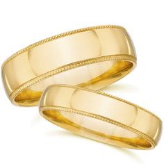 two yellow gold wedding bands on white background