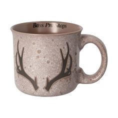 a coffee cup with antlers painted on the side and words boss pro shops above it