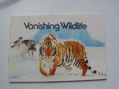 a sticker depicting two tigers walking in the snow with another tiger running behind them