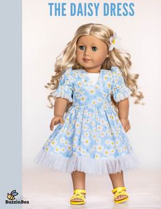 an american girl doll with blonde hair and blue dress that says, the daisy dress