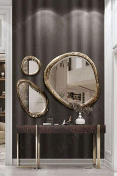 an elegant bathroom with two mirrors on the wall