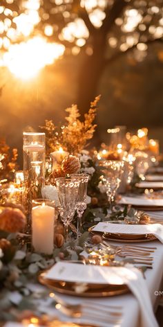 Sunlit table set with candles and flowers for an elegant outdoor fall wedding, perfect for autumn wedding color palettes with warm, romantic decor. Romantic Fall Tablescape, Autumn Wedding With Pumpkins, Fall Vibe Wedding, How To Combine Thanksgiving And Christmas Decor, Dark Tablecloth Wedding, Thanksgiving Wedding Decorations, October Themed Wedding, Fall Dinner Tablescape, Candle Lit Dinner Party Aesthetic