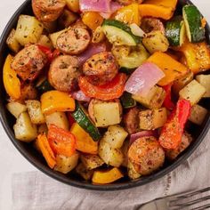 air fryer sausage and veggies in a skillet with text overlay