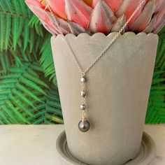 "Looking for something unique and different. This beautiful necklace displays a nice and small Tahitian Pearl paired with small and dainty Tahitian keshis pearls . ✨Necklace length : 17-18\" if you need a different size please specify at checkout . There is an extender on the back to make it more versatile and can be adjusted slightly ,about 1\" . ✨Pendant length: approximately 2 inches. ✨Tahitian pearl : Size : 8-9mm small and dainty size Shape : Tear drop Color : Color may vary Quality : Good Long Drop Pearl Charm Necklace As Gift, Long Drop Pearl Charm Necklace For Gift, Gift Long Drop Pearl Charm Necklaces, Tahitian Pearl Drop Necklace As Gift, Tahitian Pearl Drop Necklace For Gift, Handmade Tahitian Pearl Necklace Gift, Tahitian Pearl Briolette Necklace For Gifts, Tahitian Pearl Charm Jewelry For Wedding, Tahitian Pearl Charm Wedding Jewelry