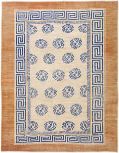 an old rug with blue and white designs on it