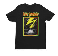 Hardcore band Bad Brains Capitol print on a black tee. Material: 100% Cotton Tops: T-Shirt Fit: Standard Color: Black Genre: Punk, Hardcore Bad Brains Shirt, Alternative Funny Print T-shirt For Streetwear, Band Merch Shirt With Funny Print For Streetwear, Punk T-shirt With Funny Print For Streetwear, Pop Culture Funny Print Shirt For Streetwear, Punk Style T-shirt With Funny Print For Streetwear, Edgy T-shirt With Funny Print For Streetwear, Alternative Style Funny Print T-shirt For Streetwear, Punk Style Funny Print T-shirt For Streetwear