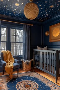 a baby's room with blue walls and stars painted on the ceiling, along with a crib