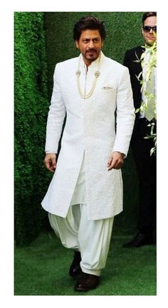 This is a Classy white sherwani and patiyala salwar, by GoldenfashionStore /crafted from high quality fabric and imported materials. Our products are handcrafted by experienced tailors who make sure the that the stitching is precise, lining is proper and the overall product is sturdy enough to not go out of shape for more than a few years. Also all our products have extra margins in their length, sleeves, sides so it's easily alterable if your size changes after some time. To see more available Srk Sherwani, Western Groomsmen, Unique Mens Wedding Suits, Sherwani Design, White Sherwani, Indian Wedding Clothes For Men, Nike Slippers, Sherwani For Men Wedding, Design Kurta