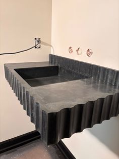 an unusual sink in the corner of a room