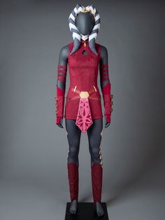 an image of a costume on display in a studio setting with gray background and grey backdrop