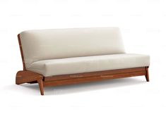 a white couch sitting on top of a wooden frame