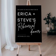 a black and white wedding sign on an easel