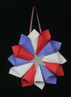 a red, white and blue origami decoration