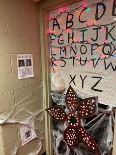 a door decorated with christmas lights and paper snowflakes is shown in front of a bulletin board