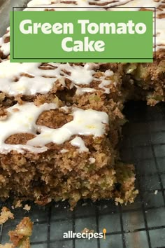 a close up of a cake on a rack with the words green tomato cake above it