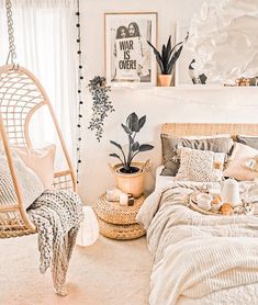 a bedroom with a hammock hanging from the ceiling and plants on the wall