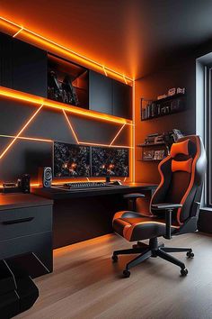 an orange and black room with a desk, chair, computer monitor and other items