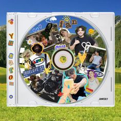 a cd with many pictures on it sitting in the grass