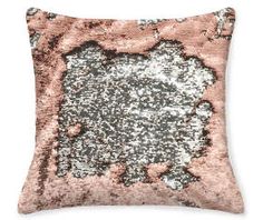 a pink and silver pillow with sequins on it