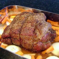 a roasting pan filled with meat and vegetables