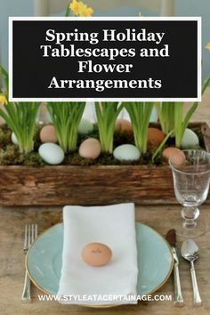 a wooden box filled with eggs and flowers on top of a table next to silverware