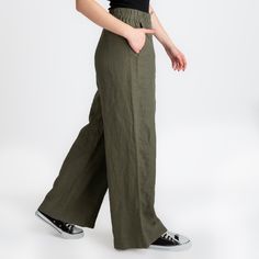 We use GOTS, OCS, GRS, European Flax and Oeko Tex certified linen fabrics. All of our products are handmade from 100% LINEN.  Product Description  - Wide leg palazzo pant - Elastic waistband  - Mid-waisted  - Side pockets  - Straight leg design  - Color seen in the photo Hunter - **You can request special measurements for exact fit ★ Model ★ - Model is 5′8″ (175cm) tall,  - She wears M Bust 87cm(34.2″)  Waist 82cm(32.2″)  Hips 96cm(37.7″) 🧼 Washing - Drying Process 🧼 The product has been washed and softened. It will not shrink when you wash it according to the rules. You can machine wash in cold water at 30o on a delicate program. You will get the best results if you hang it to dry. Dry it in the dryer at low temperature and on a short program. However, if you prefer to iron it, iron it Khaki High-waist Relaxed Fit Pants, High Waist Relaxed Fit Khaki Pants, Green Relaxed Fit Wide-leg Pants, Khaki High-waist Relaxed Fit Bottoms, High Waist Khaki Bottoms With Relaxed Fit, Khaki High Waist Relaxed Fit Bottoms, Trendy Wide Leg Linen Bottoms, Versatile Green Trousers, Trendy Linen Bottoms With Pockets