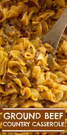 ground beef and country casserole in a skillet with a wooden spoon on the side