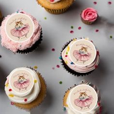 cupcakes decorated with pink frosting and decorations