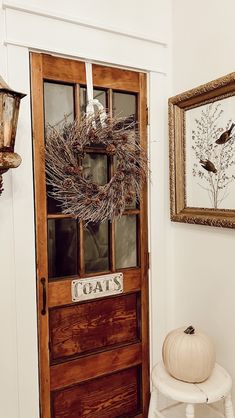 a wooden door with a wreath on it